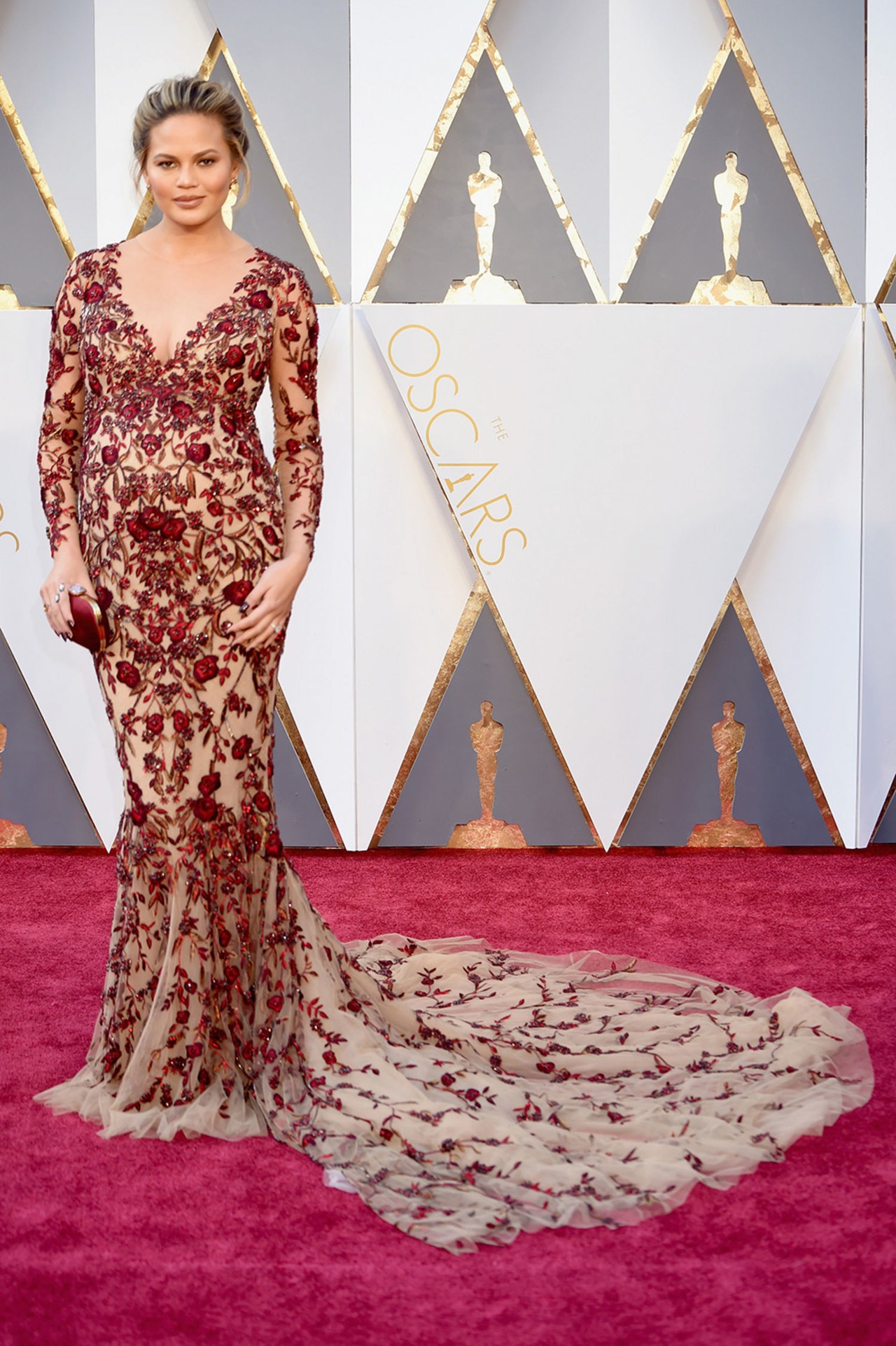 Chrissy Teigen at the Oscars in 2016 wearing Marchesa. Photo sourced via Pinterest Chrissy Teigen in 2016 wearing Marchesa. Photo sourced via Pinterest