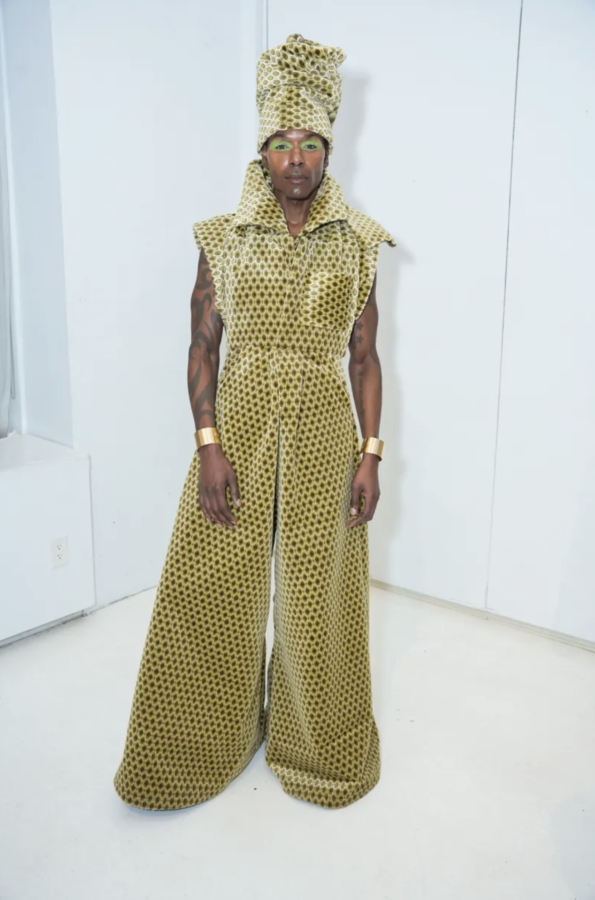 Model dressed in a head to toe lime jumper designed by Joseph McRae.