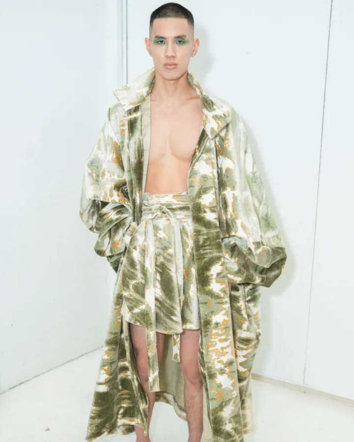 Model in a two-piece shawl and short set designed by Joseph McRae.